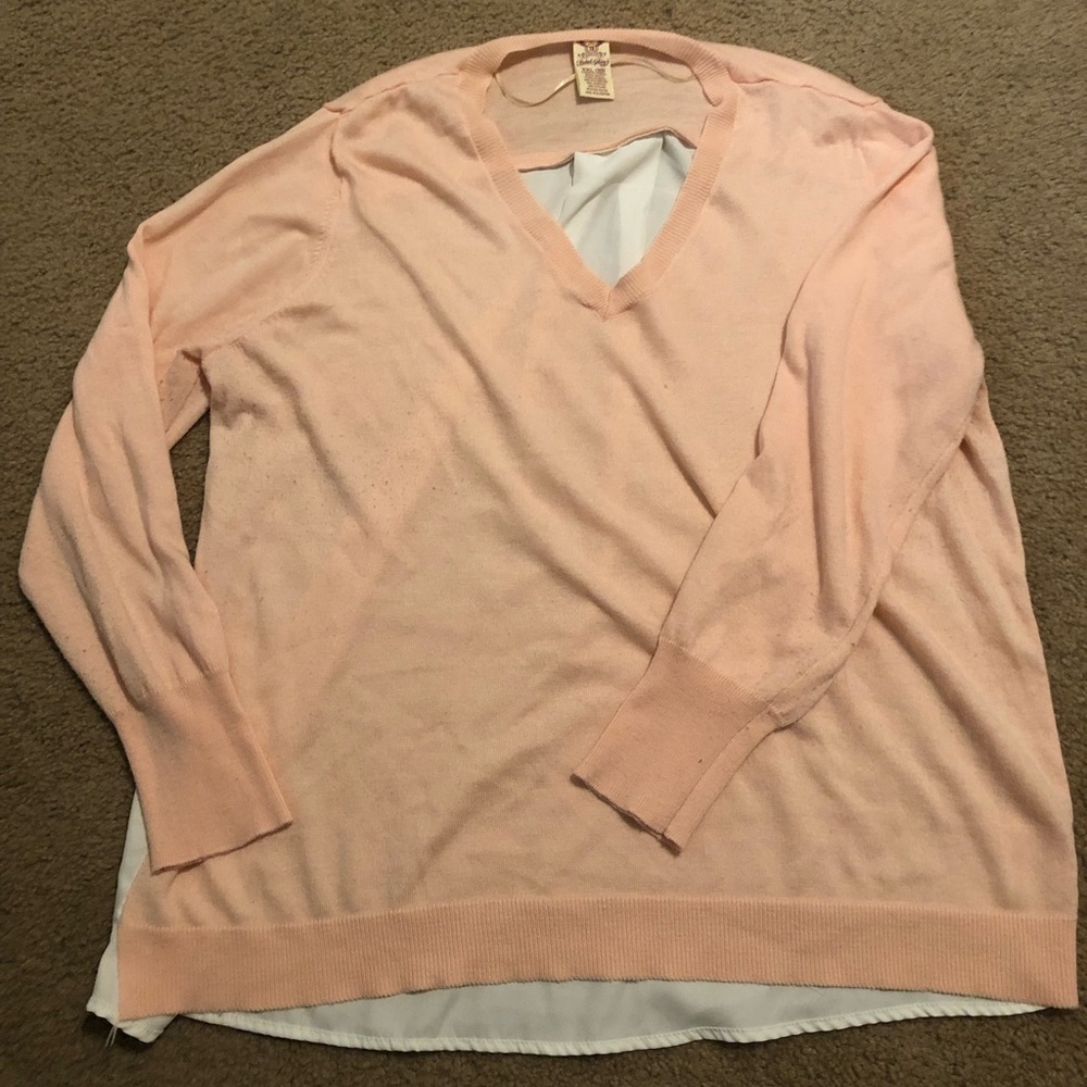 Baby pink sweater that has a white flowy back